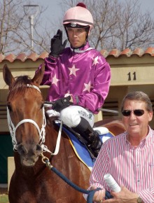 In the pink. Delpech is back and trainer Neil Bruss is all smiles.