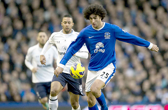 Everton's Belgian midfielder Marouane Fellaini (R) vies for the ball during the English Premier League football match between Everton and Tottenham Hotspur at Goodison Park in Liverpool, north-west England on December 9, 2012. AFP PHOTO / ADRIAN DENNIS