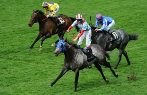 Jamie Spencer celebrates as York Glory wins the Wokingham Stakes