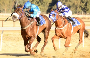 Sand Hand. Here Comes Billy (S'manga Khumalo) draws clear to beat Uncle Tommy (in stripes). JC Photos
