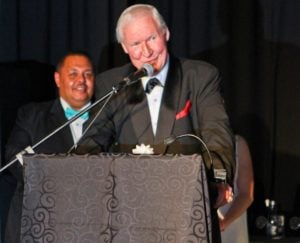 Rodney Dunn accepts his award. MC Rouvaun Smit is in the background