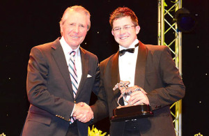 Matthew De Kock collects an Equus award from Gary Player