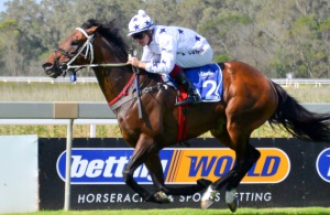 Fanning The Flames. Keagan Latham has Celtic Fire on a tight rein as he surges clear in the Listed Memorial Mile (Coastal Photos)