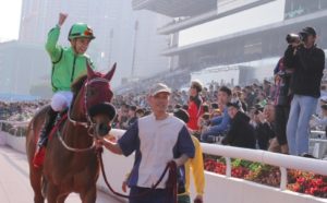 A jubilant Joao Moreira parades Military Attack in front of the Sha Tin crowd as the reigning Horse of the Year heads back to the winner's circle. Photo: Kenneth Chan