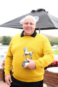 Mike Azzie holds the trophy after a superb win (JC Photos)