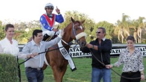 Owner Brian Burnard(dark shirt) celebrates at the lead in