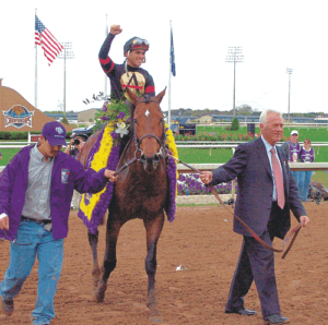 Frank Stronach (right) leads in a  winner