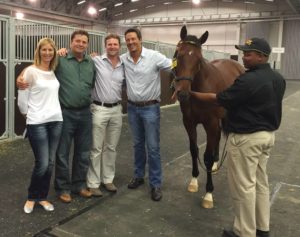 Candice Bass poses with new owner Piet du Toit and fellow Game breeders and investors Richard Morton and Beyers Gerber with the R5,2 million record-breaker