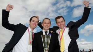 Part-owners Simon Pickworth, left, Andrew Skelton, right, celebrate with trainer Chris Waller after Brazen Beau’s win in the Coolmore Stud Stakes. Pic-Colleen Petch