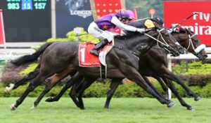 Quechua (Corey Brown, black cap) holds off the challenges from War Affair (Alan Munro, in purple)  and Fastnet Dragon (Hugh Bowman)