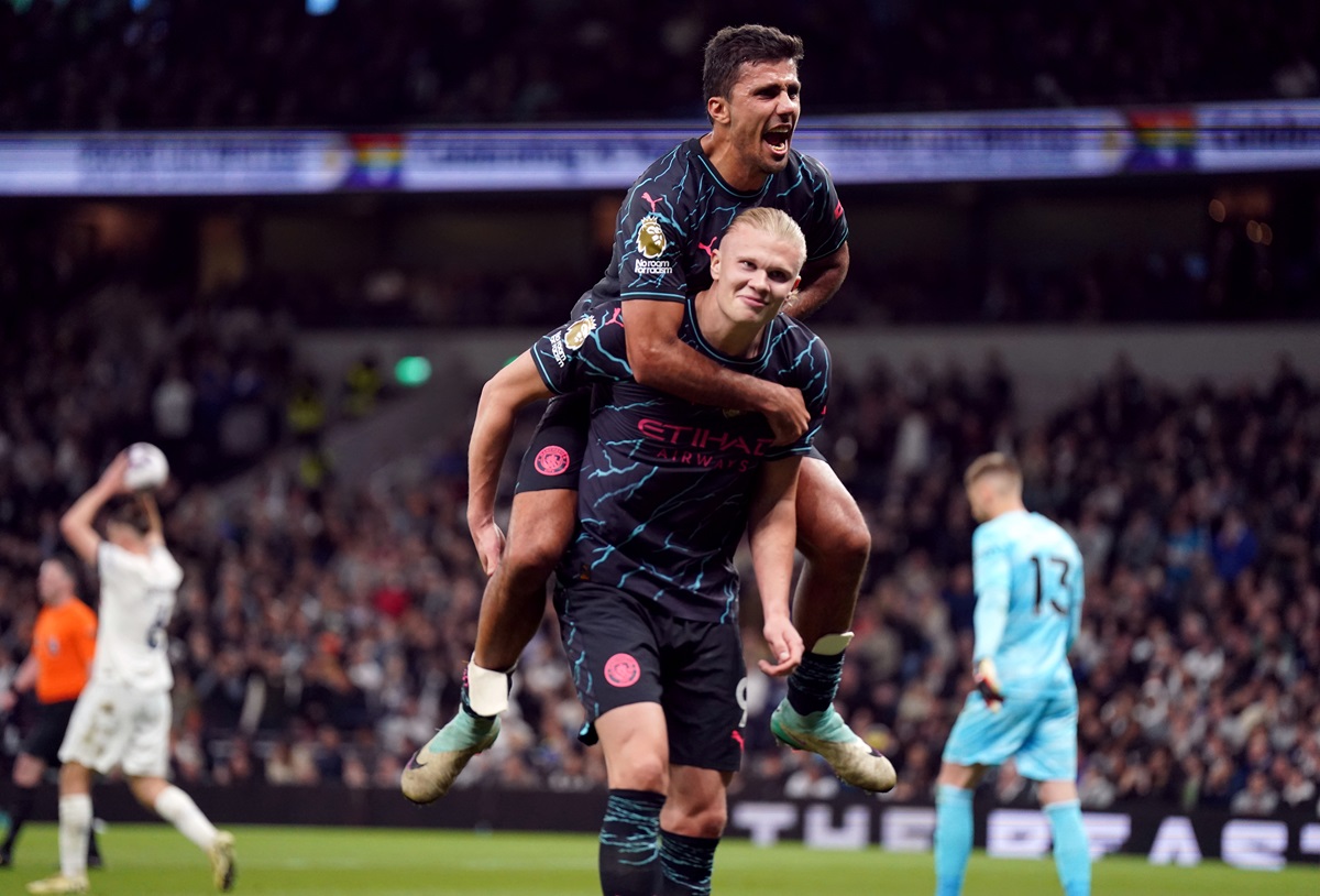 Manchester City's Erling Haaland celebrates scoring their side's second goal of the game with team-mate Rodri during the Premier League match at the Tottenham Hotspur Stadium, London