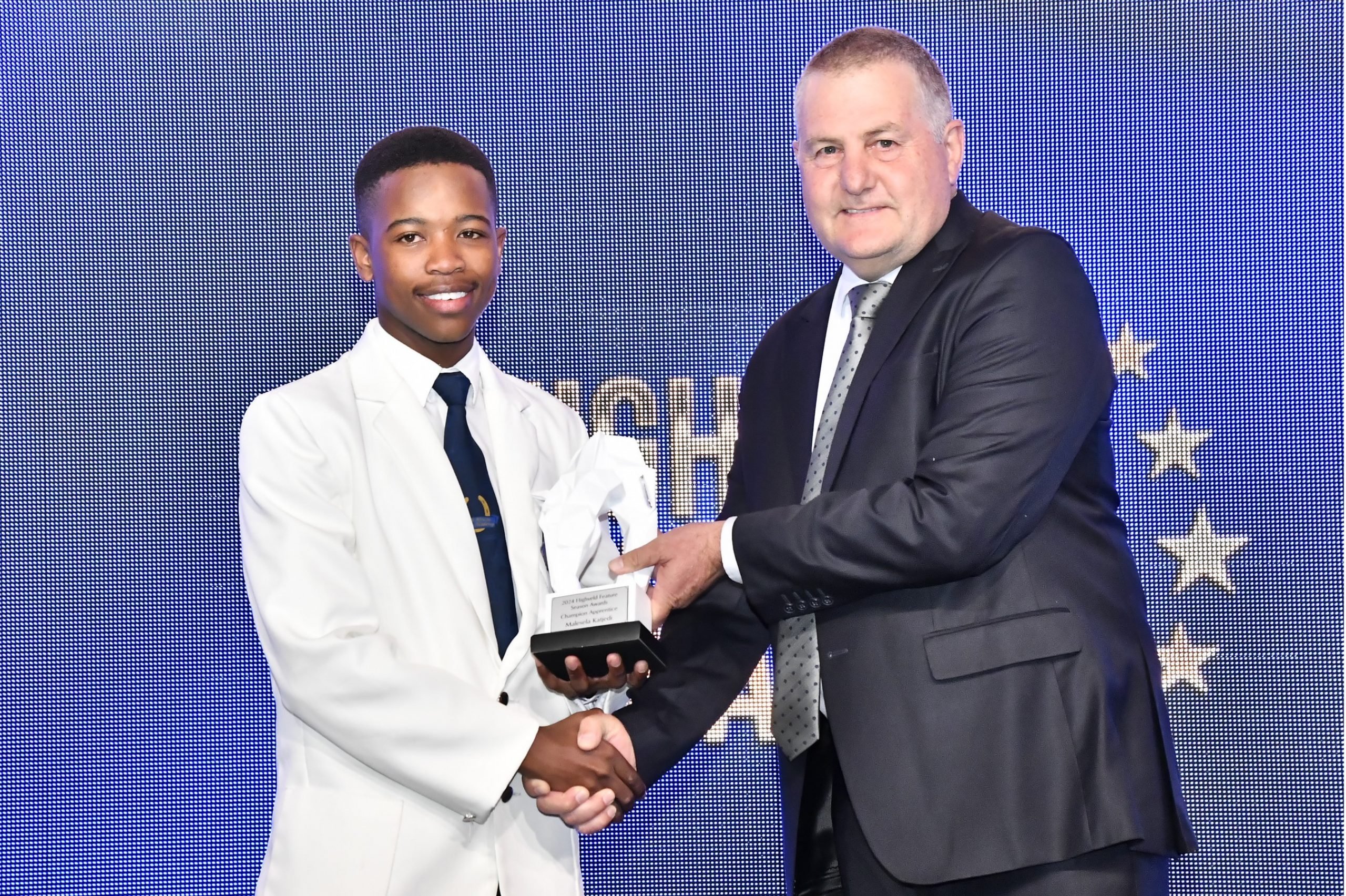 Keratile receives his trophy from Riding Master, Robert Moore