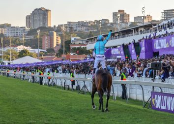 Oriental Charm and JP van der Merwe enjoy their victory canter