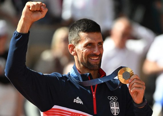 Gold medal winner Novak Djokovic of Serbia poses for a photo during the medal ceremony for the Men Singles of the Tennis competitions in the Paris 2024 Olympic Games