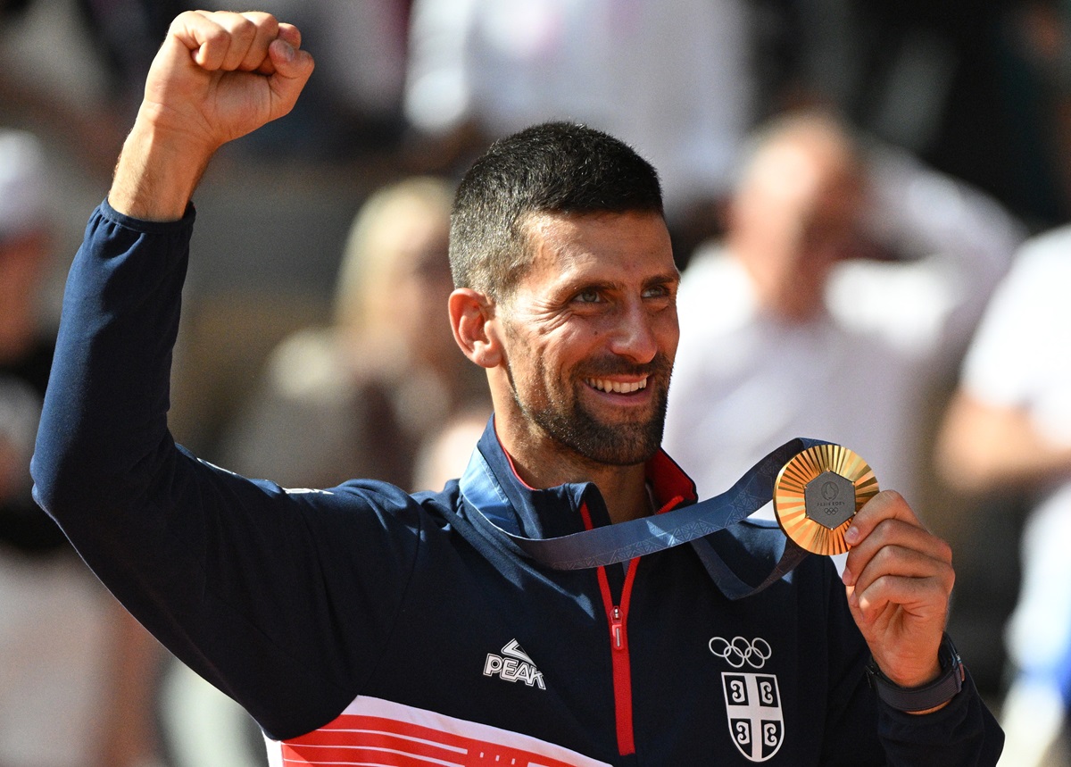 Gold medal winner Novak Djokovic of Serbia poses for a photo during the medal ceremony for the Men Singles of the Tennis competitions in the Paris 2024 Olympic Games