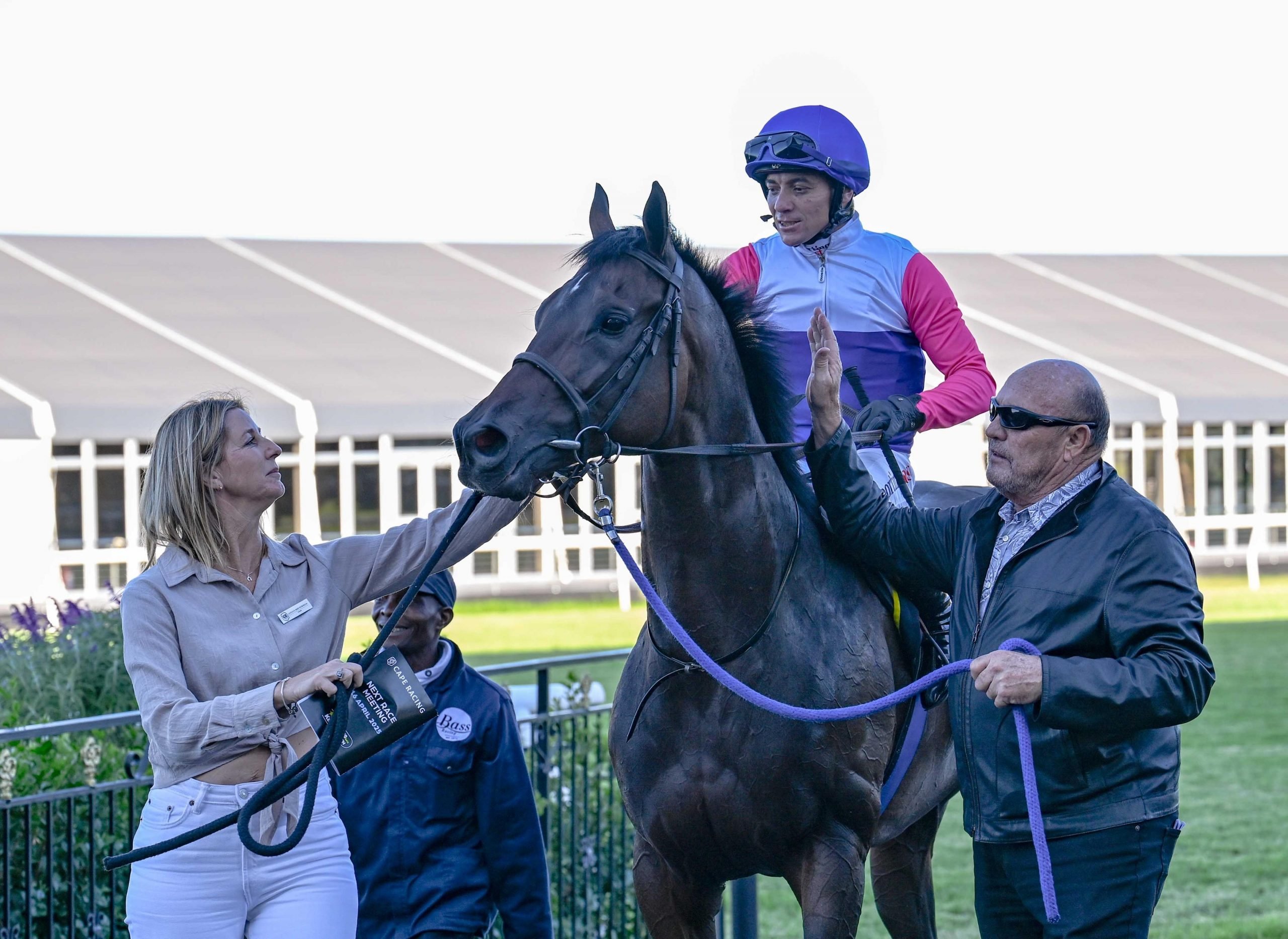 Top racing man Marsh Shirtliff leads in another winner with Candice Bass-Robinson on right and Sean Veale in the saddle (Pic - Chase Liebenberg)