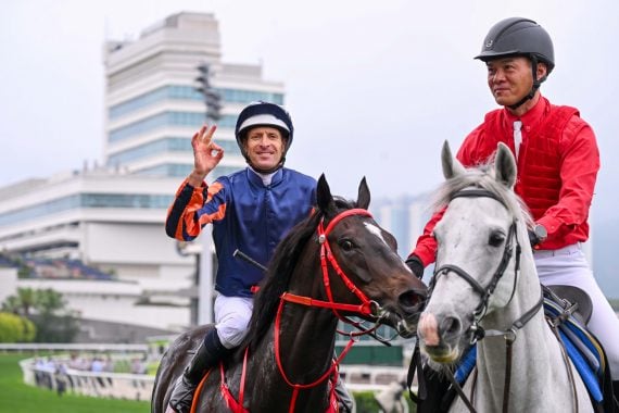 Hugh Bowman celebrates Group 1 glory with Red Lion last month (Pic - HKJC)