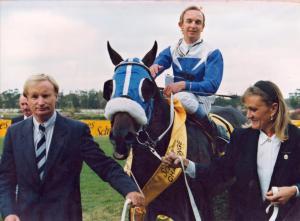 Chris and Sue Snaith lead Flaming Rock (Karl Neisius) in after his 1992 Schweppes Challenge victory (Pic - Supplied)