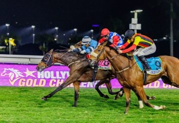 Muzi Yeni drives Madison Valley down the middle as Underworld (Richard Fourie on outside) and On My Honour (Chad Little) put the pressure on (Pic - Candiese Lenferna)