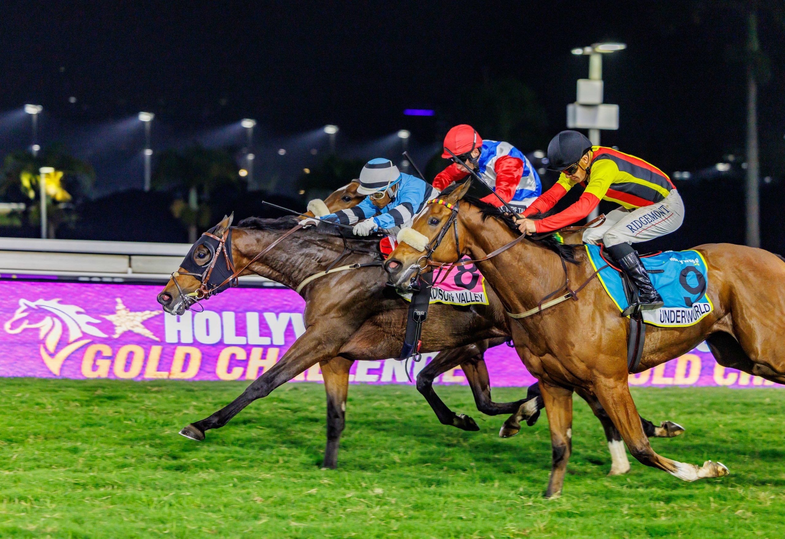 Muzi Yeni drives Madison Valley down the middle as Underworld (Richard Fourie on outside) and On My Honour (Chad Little) put the pressure on (Pic - Candiese Lenferna)